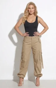 Model wearing CALIFLO's snatched activewear bodysuit with brown cargo pants