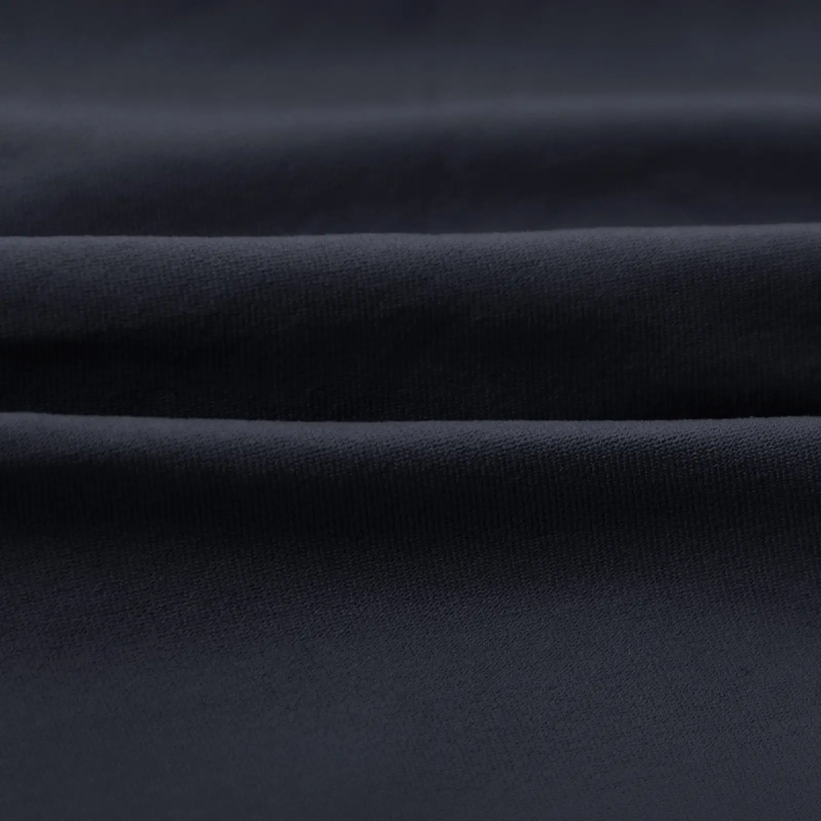 CALIFLO Casual Chic T-shirt Crew Neck Bodysuit black fabric close up 3 Close-up of folded black soft fabric.