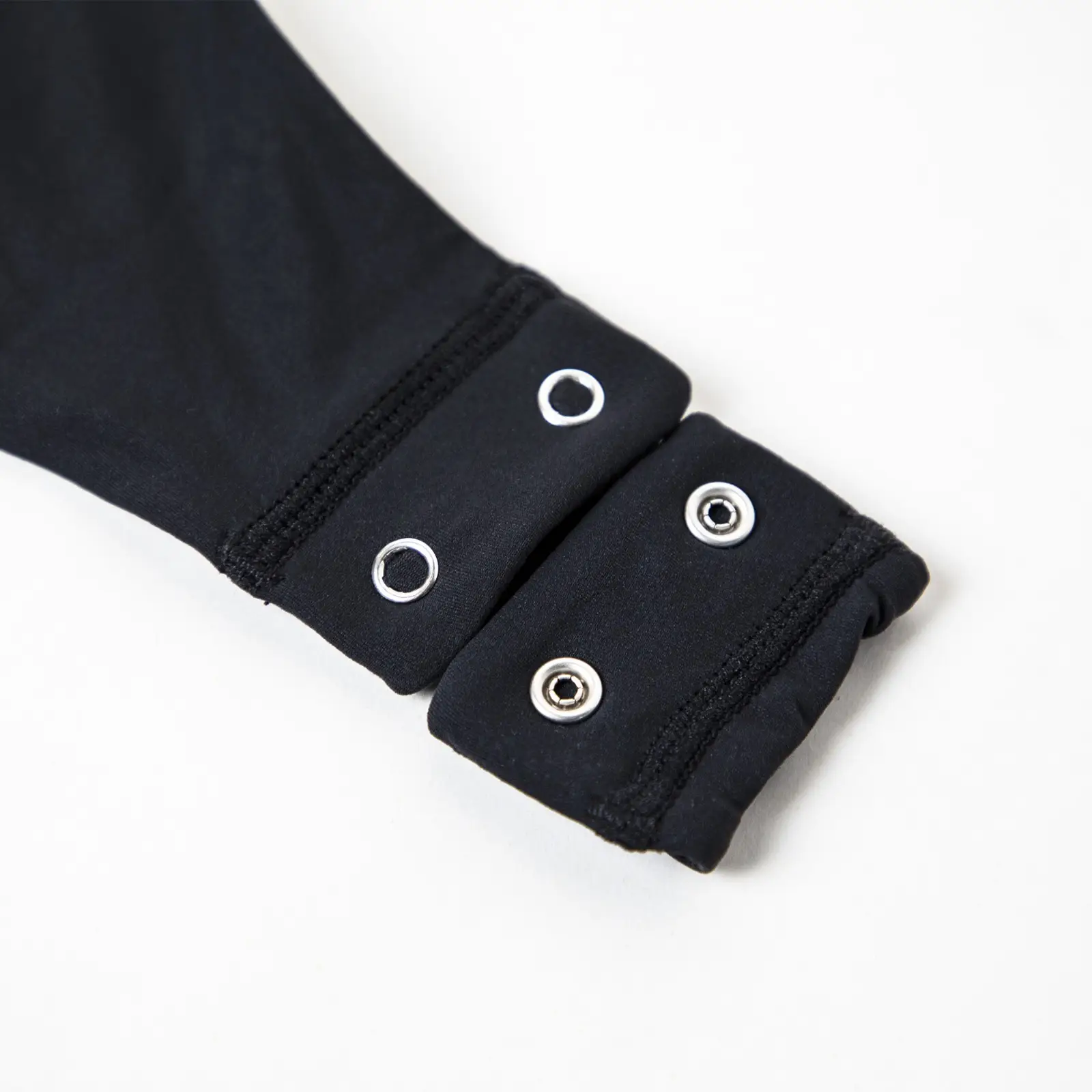 CALIFLO Casual Chic T-shirt Crew Neck Bodysuit black thong snap open Close-up of the snap-on crotch system of a bodysuit.