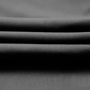 CALIFLO High compression activewear long sleeve low cut bodysuit black fabric close up 2 Close-up of black fabric folded