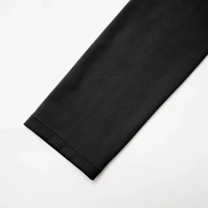 CALIFLO Activewear High-Compression Long Sleeve Crew Cut Bodysuit black Close-up of black long sleeve bodysuit sleeve over a white background