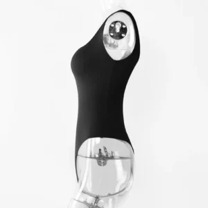 Transparent torso acrylic mannequin wearing a black sleeveless low cut bodysuit profile over a white wall.