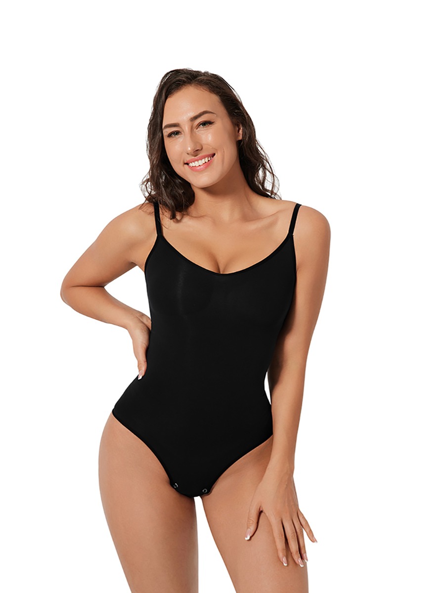 CALIFLO Seamless high compression bodysuit brief black hand on hip front angle smiling 4