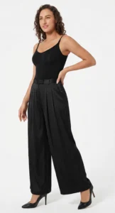 Model wearing a CALIFLO's Classic Body Shaper Bodysuit Model wearing califlo classic body shaper thong with black pants