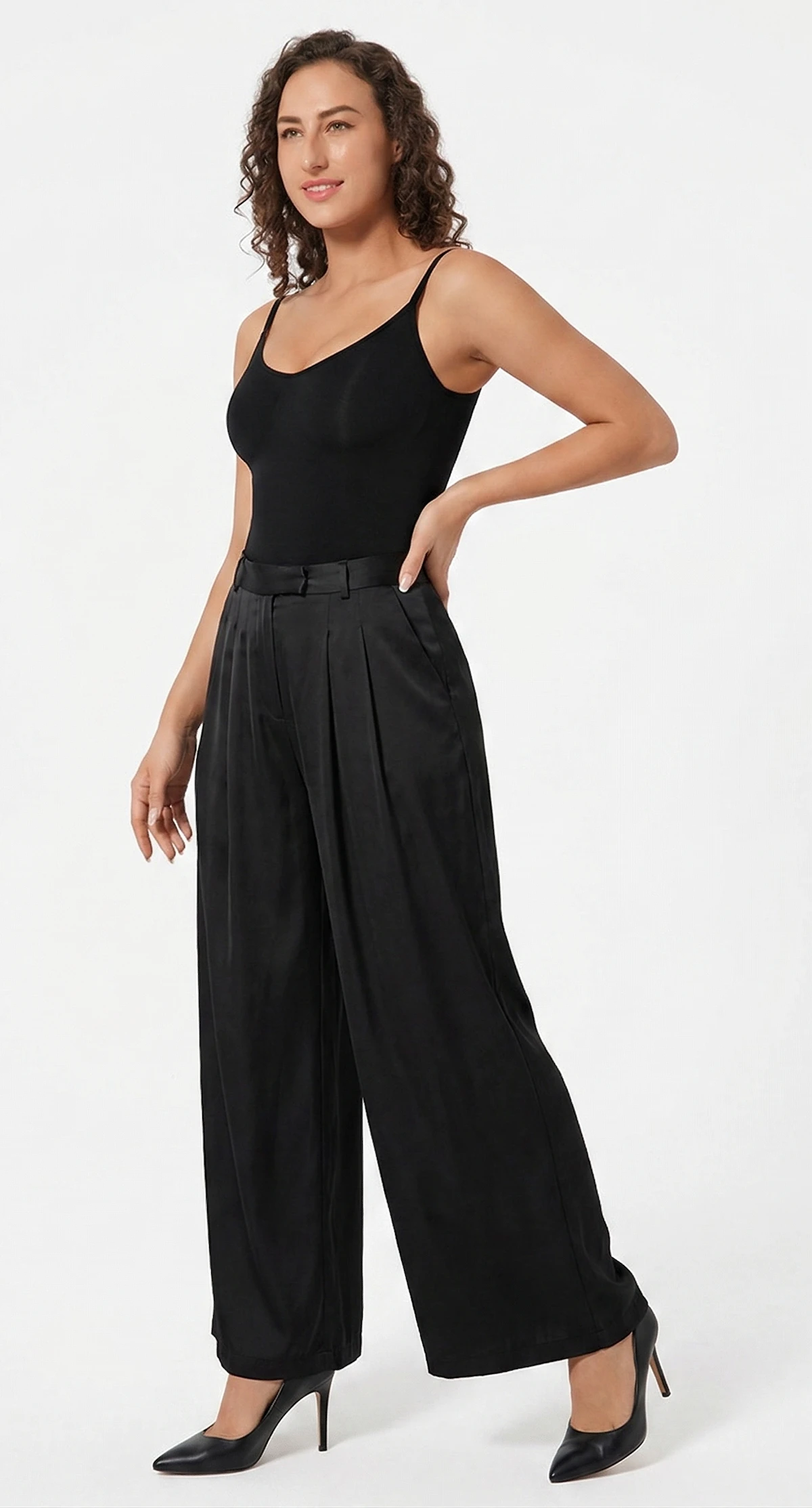 Model wearing a CALIFLO's Classic Body Shaper Bodysuit Model wearing califlo classic body shaper thong with black pants