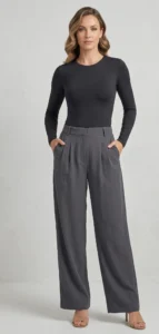 Woman_wearing_black_long_sleeve_crew_cut_snatched_bodysuit_grey_pleated_pants