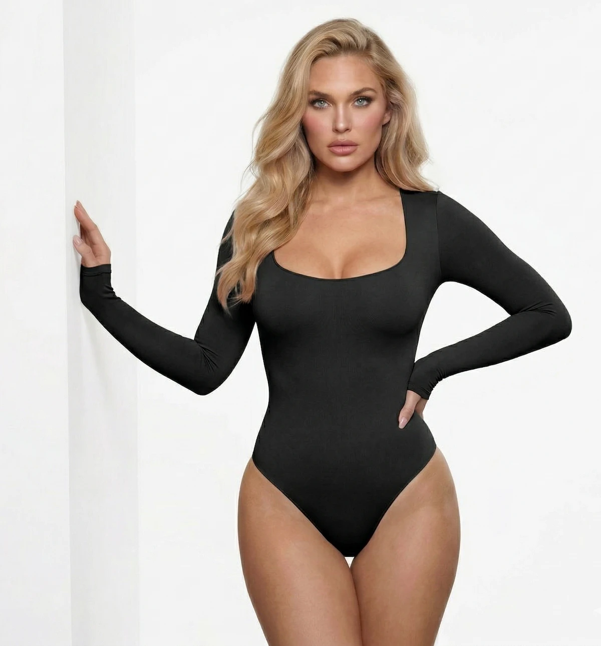 Woman_wearing_black_snatched_activewear_long_sleeve_low_cut_bodysuit