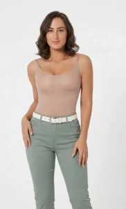 Hispanic woman wearing califlo beige classic body shaper brief with green pants