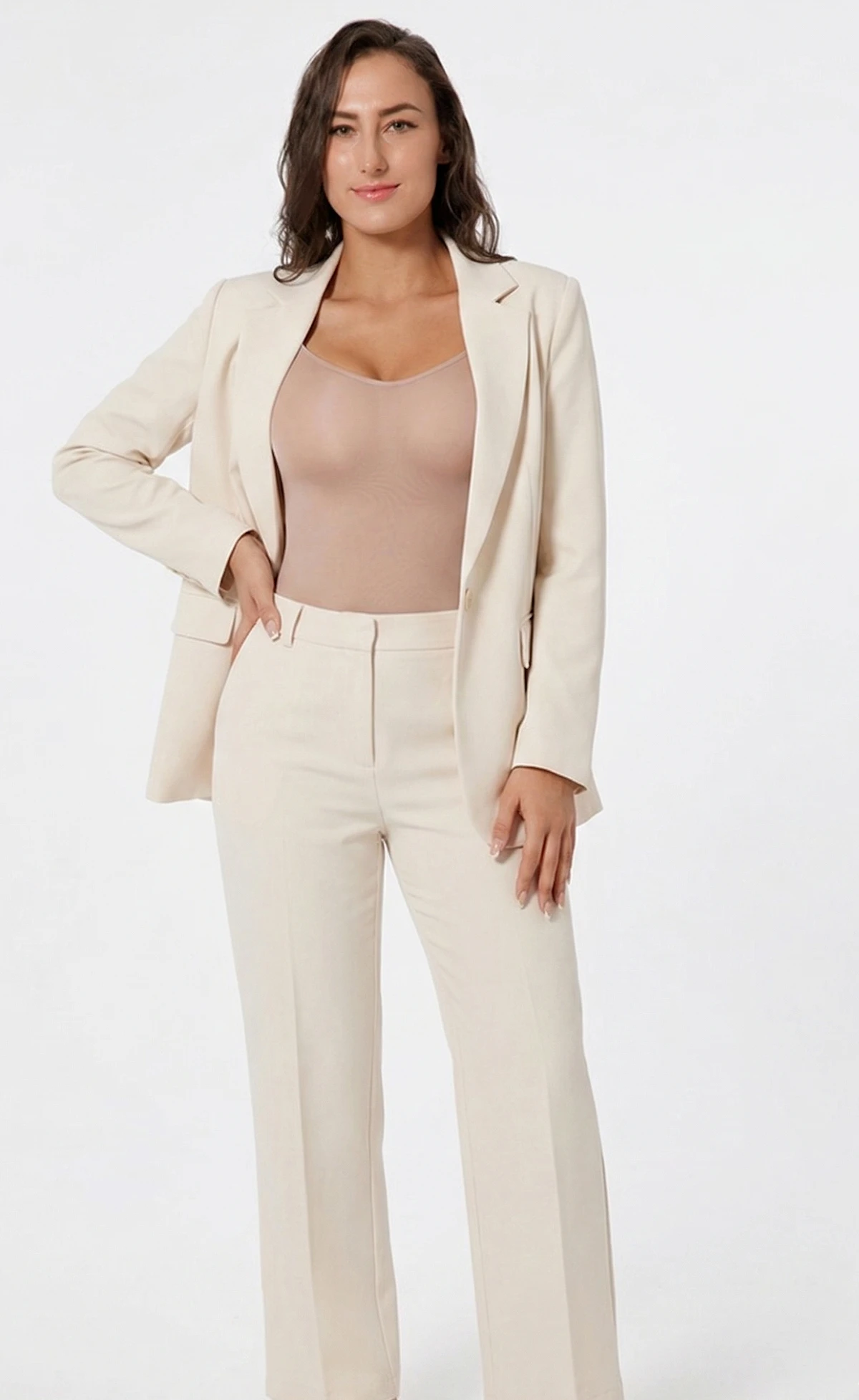 Hispanic woman wearing califlo classic body shaper brief in beige with cream suit