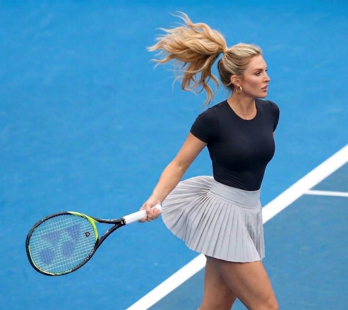 Model wearing a CALIFLO's Snatched Activewear Bodysuit Woman playing tennis wearing a black t-shirt bodysuit and light gray tennis skirt in a blue court.