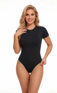 Woman wearing CALIFLO's Snatched Activewear Black Bodysuit Model wearing califlo snatched active bodysuit in black over white background