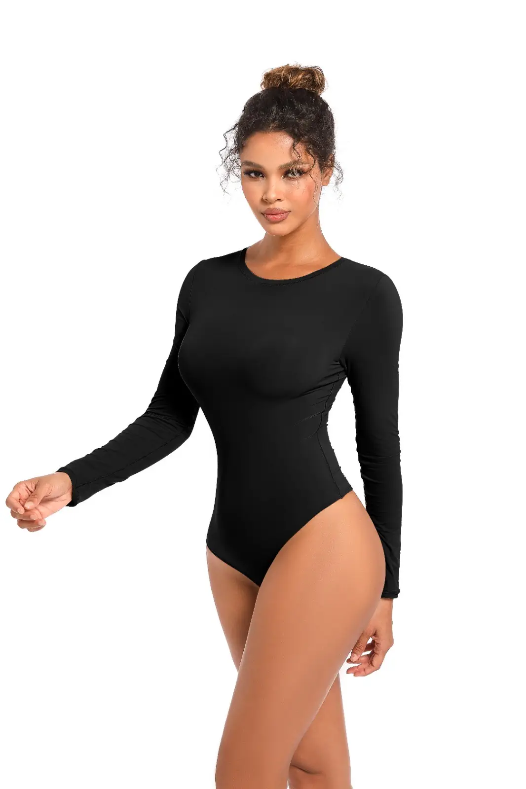Light Compression Thunder Soft Long Sleeve Crew Neck Bodysuit black A woman with dark hair styled in a messy bun, standing confidently in front of a white background, wearing a sleek, solid-...